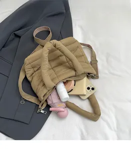 Quilted tote bag interior view showing space for umbrella, wallet and phone