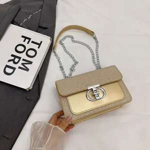 Elegant champagne gold sequin crossbody bag with silver double D buckle and chain strap