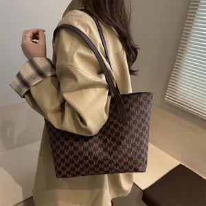 Retro large capacity tote bag with brown letter print on a stylish model