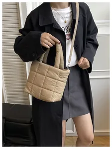 Quilted tote bag in khaki nylon with padded handle and detachable shoulder strap detail