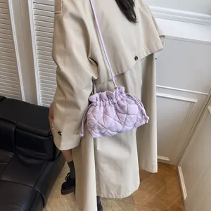 Minimalist lavender quilted drawstring puff shoulder bag with diamond stitch texture
