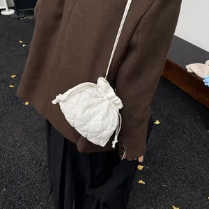 White quilted drawstring cloud bag for women in stylish ruched puff bucket style