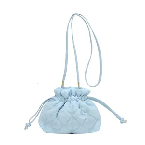 Sky blue quilted drawstring puff bag with stylish pleated clouds texture and shoulder strap