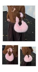 Detail of pink faux fur dumpling bag featuring soft plush texture and silver metal chain