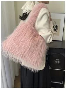 Chic pink faux fur hobo tote bag with long plush texture and wide shoulder strap