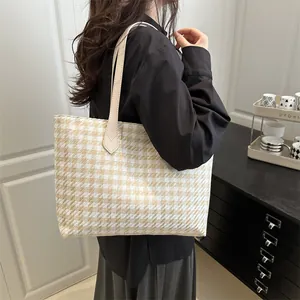 Chic houndstooth pattern large capacity tote bag shown from a side view on shoulder