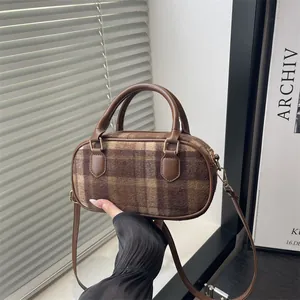 Chic brown plaid wool crossbody bag for women with leather handles and gold hardware
