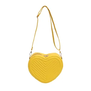 Minimalist yellow heart-shaped crossbody bag with V-quilted stitching and golden zipper