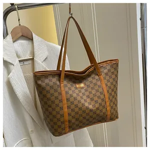 Detailed macro of geometric pattern texture and metal nameplate on the tote bag