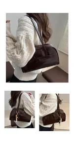 Detailed view of vintage dark brown faux leather shoulder bag with beaded charm and stitching