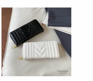 Quilted long wallets for women with V-stripe texture and gold zippers in black and white