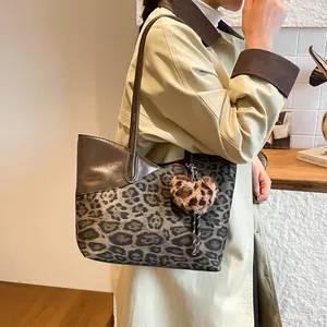 Retro leopard print suede tote bag with brown leather straps and plush heart charm