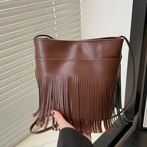 Brown vintage PU leather shoulder bag with long tassels and minimalist crossbody strap