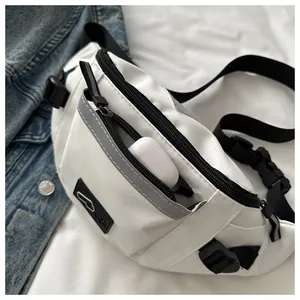 Close-up of white chest bag featuring grey reflective strips and adjustable buckle strap