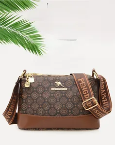 Close-up of vintage print bucket bag with kangaroo logo and wide patterned strap