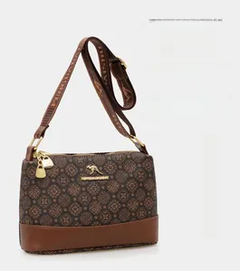 Detail of vintage pattern bucket bag with brand logo and wide jacquard shoulder strap