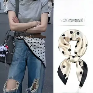 Polka dot silk scarf shown as both a stylish waist accessory and a classic necktie