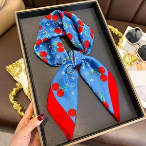 Royal blue cherry print silk scarf with red border and monogram floral patterns
