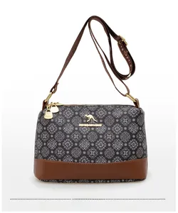 Detail view of vintage mandala print crossbody bag with kangaroo logo and zip closure