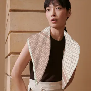Detail of premium velvet silk square scarf with luxury pattern on an Asian model