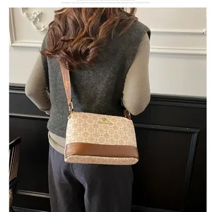 Vintage floral bucket bag with kangaroo logo and wide jacquard strap for women