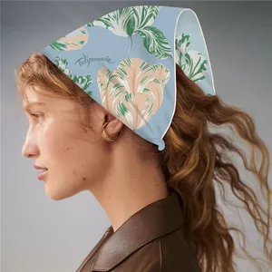 Detail of blue twill silk scarf featuring realistic Tulipomanie floral prints and white edges