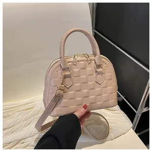 Beige quilted shell bag with checkered pattern and gold hardware strap