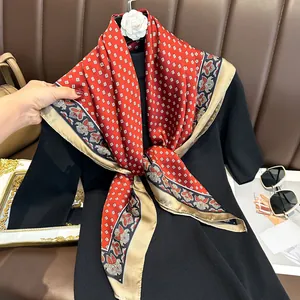 Detailed texture of red vintage satin silk square scarf with geometric and floral pattern