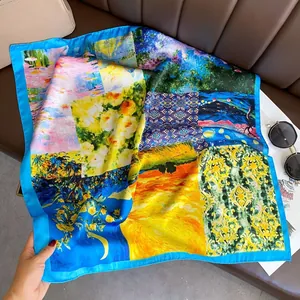 Close-up of a vibrant silk-like square scarf featuring art-inspired patterns and blue edges