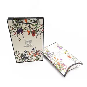 Detailed view of floral gift box and matching paper bag for premium scarves and mufflers