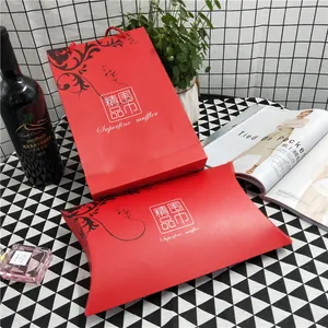 Premium red scarf gift box and matching paper bag set with floral design on checkered tablecloth