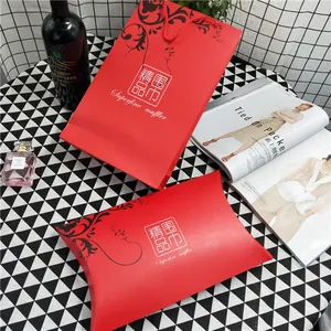 Elegant red scarf gift box and matching paper bag with floral vine pattern design