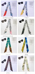Selection of eight printed skinny silk scarves featuring architectural and floral patterns