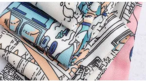 Macro shot of the twill fabric texture and cartoon printed patterns on a narrow scarf