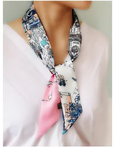 Detail of 100% silk twilly scarf featuring hand-drawn illustration tied around the neck