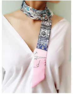 Close-up of narrow printed silk scarf twilly with architectural and art illustration