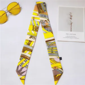 Detail of yellow and gray geometric silk twilly scarf with abstract artistic printing