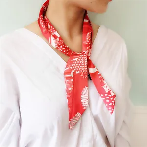 Fashionable red floral twilly silk scarf tied on neck with geometric patterns