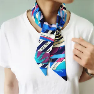 Vibrant color-block silk-like polyester twilly scarf with letter prints on white t-shirt