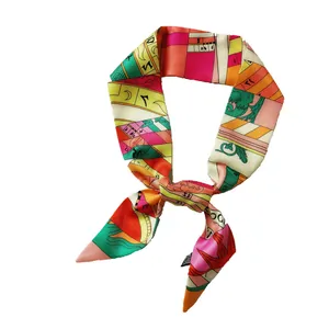 Colorful silk-like scarf with geometric alphabet print and vibrant patchwork design