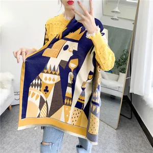 Mirror selfie showing thick navy and yellow poker king scarf with tassels and casual outfit