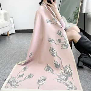 Detail of pink cashmere-like shawl with elegant grey and cream tulip floral patterns