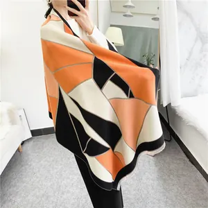 Thick geometric color block scarf for women with orange black and beige patterns and tassels
