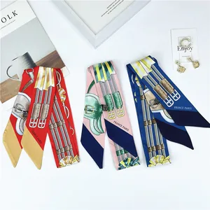 Detailed view of colorful vintage print silk scarves with retro patterns on white background