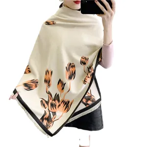 Elegant cream cashmere-feel shawl with orange tulip patterns and fringed edges
