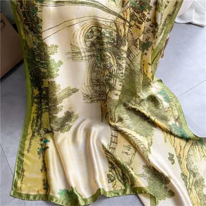 Detail of vintage oil painting style silk scarf with green rolled edge and artistic landscape