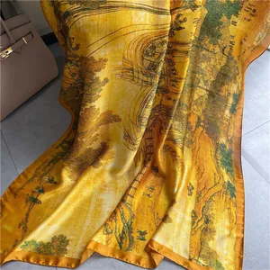 Detail of silk scarf with landscape print, draped on floor with elegant folds