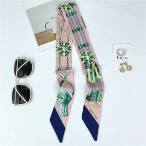 Pink silk twilly scarf with French style prints, sunglasses and jewelry styling accessories
