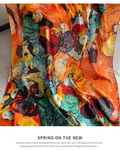 Close-up of artistic impressionist oil painting silk scarf with vibrant orange and red tones