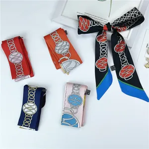 Detail of multi-color narrow twilly scarves with elegant chain patterns in five colors